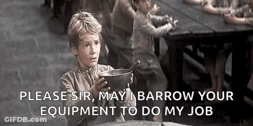 A Young Boy Is Holding A Bowl Of Soup In Front Of A Table . GIF