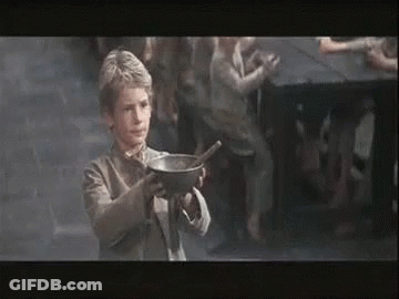 A Young Boy Is Holding A Bowl Of Soup With A Spoon In His Hand . GIF