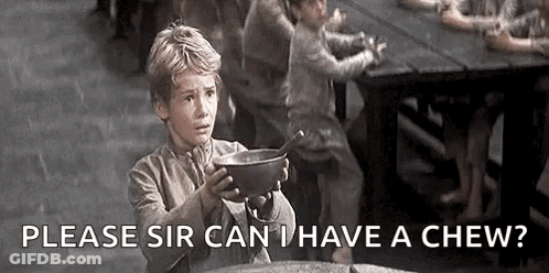 A Young Boy Is Holding A Bowl With A Spoon In It And Asking If He Can Have A Chew . GIF