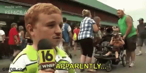 A Young Boy Is Holding A Microphone In Front Of A Crowd Of People And Says `` Apparently '' . GIF