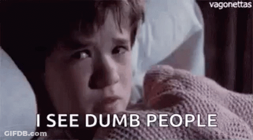 A Young Boy Is Laying In Bed With A Blanket On His Face And Says `` I See Dumb People '' . GIF
