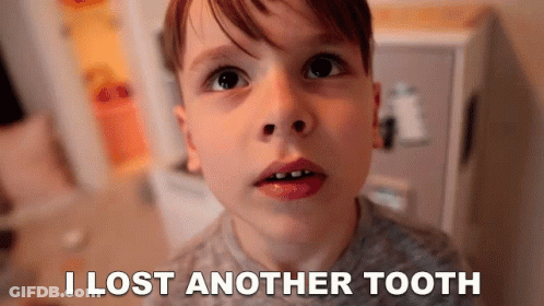 A Young Boy Is Looking At The Camera With The Words I Lost Another Tooth Behind Him GIF