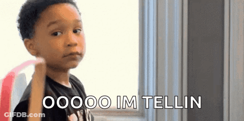 A Young Boy Is Making A Funny Face And Saying , `` Oooo Im Tellin '' . GIF
