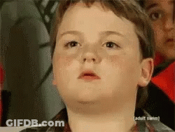 A Young Boy Is Making A Funny Face In Front Of A Sign That Says " Adult Swim " GIF
