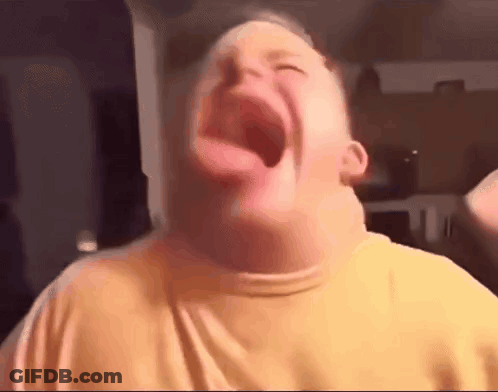 A Young Boy Is Making A Funny Face With His Tongue Out . GIF