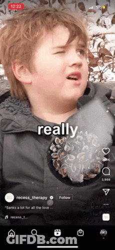 A Young Boy Is Making A Funny Face With The Words Really On The Bottom GIF