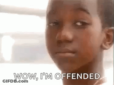 A Young Boy Is Making A Funny Face With The Words Wow , I 'M Offended . GIF