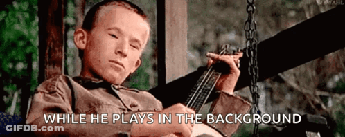 Boy Playing Guitar On Swing GIF