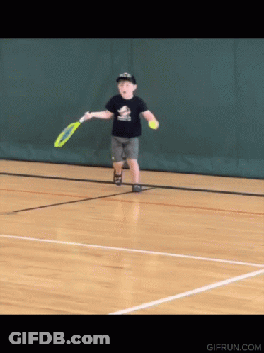 A Young Boy Is Playing Tennis On A Court With A Gifrun.com Logo In The Corner GIF