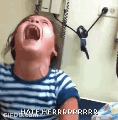 A Young Boy Is Screaming With His Mouth Wide Open And The Words Hate Herrrrrrrr Are Visible GIF