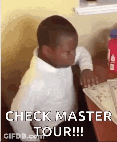 A Young Boy Is Sitting At A Table With A Book And A Bottle Of Water . GIF