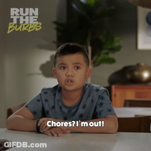 A Young Boy Is Sitting At A Table With The Words Chores I 'M Out GIF