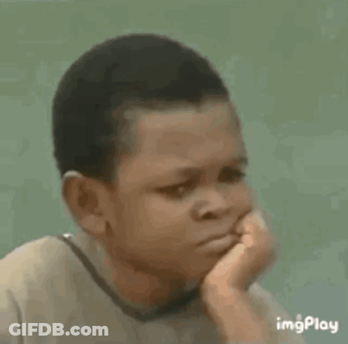 A Young Boy Is Sitting Down With A Sad Look On His Face . GIF