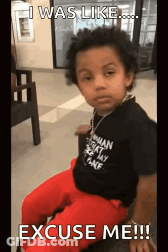 A Young Boy Is Sitting In A Chair With The Words `` I Was Like Excuse Me ! '' GIF