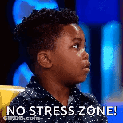 A Young Boy Is Sitting In A Chair With The Words `` No Stress Zone '' On His Face . GIF