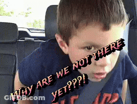 A Young Boy Is Sitting In The Back Seat Of A Car With Why Are We Not There Yet Written On His Face GIF