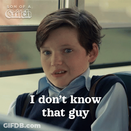 A Young Boy Is Sitting On A Bus And Says " I Don T Know That Guy " GIF