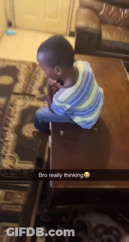 A Young Boy Is Sitting On A Table With The Words Bro Really Thinking Above Him GIF