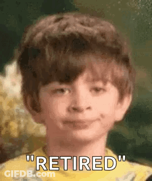 A Young Boy Is Smiling And Saying `` Retired '' In A Close Up Of His Face . GIF