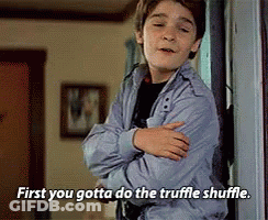 A Young Boy Is Standing In A Doorway With His Arms Crossed And Says First You Gotta Do The Truffle Shuffle . GIF