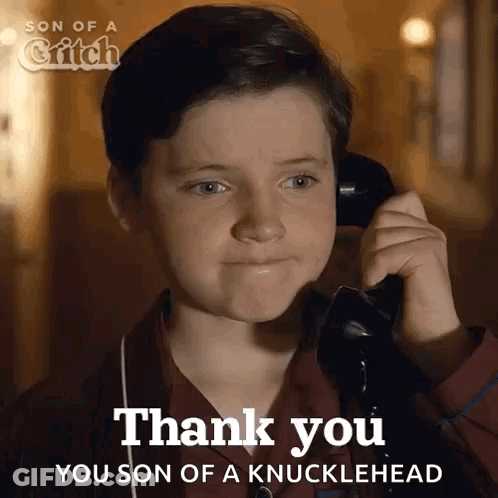 A Young Boy Is Talking On A Phone And Says " Thank You " GIF