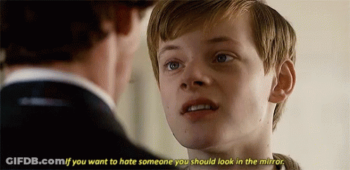 A Young Boy Is Talking To A Man In A Suit And Says `` If You Want To Hate Someone You Should Look In The Mirror . GIF