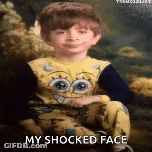 A Young Boy Is Wearing A Spongebob Pajama And Has A Surprised Look On His Face GIF