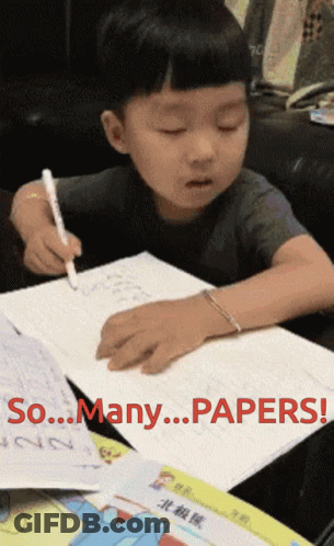 A Young Boy Is Writing On A Piece Of Paper With The Words So Many Papers Written On It GIF