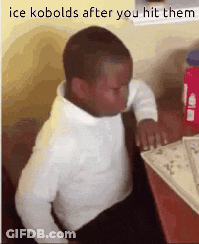 A Young Boy Sits At A Desk With The Words Ice Kobolds After You Hit Them On The Bottom GIF