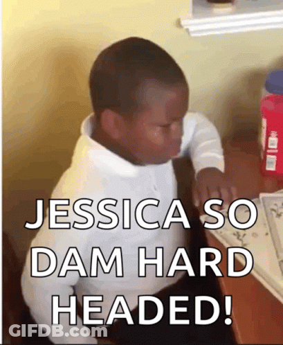 A Young Boy Sitting At A Desk With The Words Jessica So Dam Hard Headed Written Below Him GIF