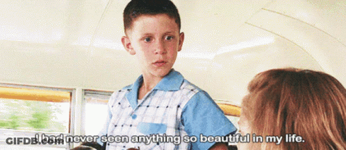 A Young Boy Talking To A Woman With The Words " I Had Never Seen Anything So Beautiful In My Life " Below Him GIF