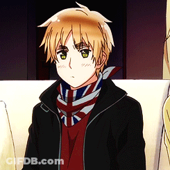 A Young Boy Wearing A Black Jacket And A Scarf With The British Flag On It GIF
