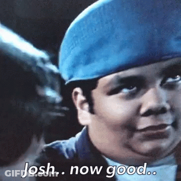 A Young Boy Wearing A Blue Hat Is Saying Josh Now Good . GIF