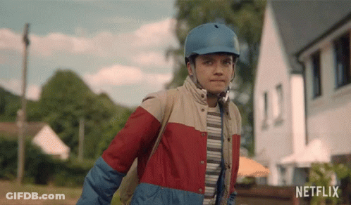 A Young Boy Wearing A Blue Helmet And A Netflix Logo GIF