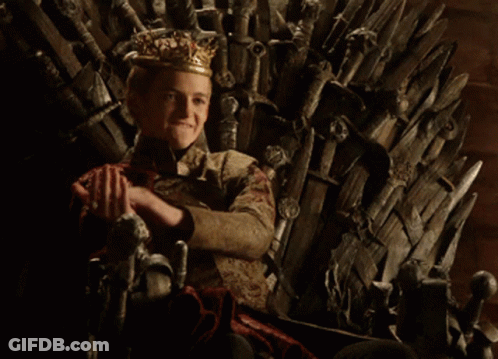A Young Boy Wearing A Crown Sits On A Throne GIF