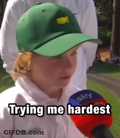 A Young Boy Wearing A Green Hat Is Talking Into A Microphone With The Words Trying Me Hardest Written Below Him GIF