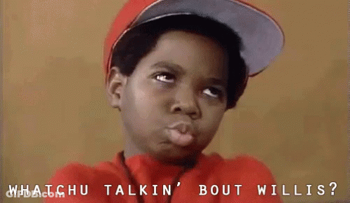 A Young Boy Wearing A Hat And A Red Shirt Is Making A Funny Face And Asking Whatchu Talkin Bout Willis . GIF