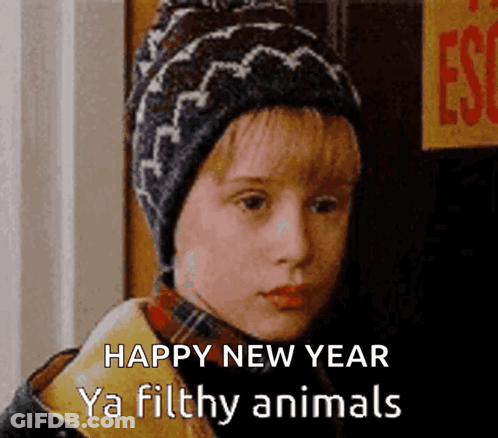 A Young Boy Wearing A Hat Says Happy New Year Ya Filthy Animals .. GIF