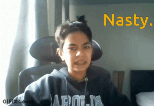 A Young Boy Wearing A Hoodie That Says Arolin Is Sitting In A Chair GIF