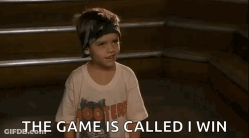 A Young Boy Wearing A Hooters T-Shirt Is Sitting On A Set Of Stairs And Talking . GIF
