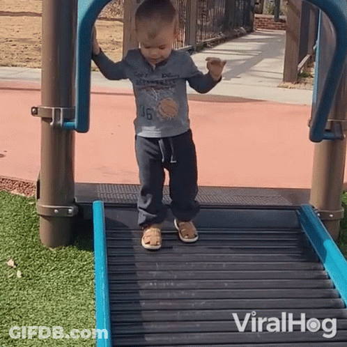 A Young Boy Wearing A Shirt With The Number 46 On It Is Walking Down A Roller Coaster GIF