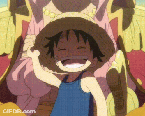 A Young Boy Wearing A Straw Hat And A Blue Tank Top Smiles With His Eyes Closed GIF