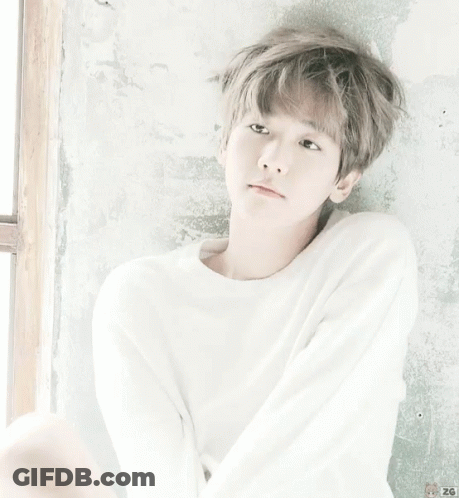 A Young Boy Wearing A White Sweater With The Number 26 On It GIF