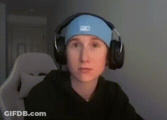 A Young Boy Wearing Headphones And A Headband Is Sitting In A Chair . GIF