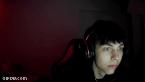 Boy With Headphones Sitting In Front Of Computer GIF
