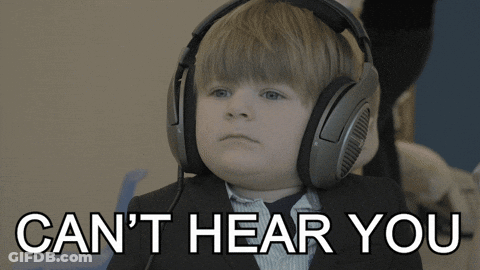 A Young Boy Wearing Headphones With The Words " Can 'T Hear You " Below Him GIF