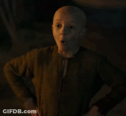 A Young Boy With A Bald Head Is Giving A Thumbs Up . GIF