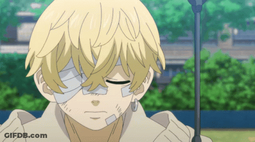 A Young Boy With A Bandage On His Eye Is Looking Down GIF