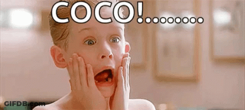 A Young Boy With A Surprised Look On His Face Is Holding His Face With His Hands . GIF