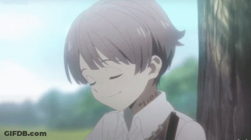 A Young Boy With A Tattoo On His Neck Is Smiling With His Eyes Closed . GIF